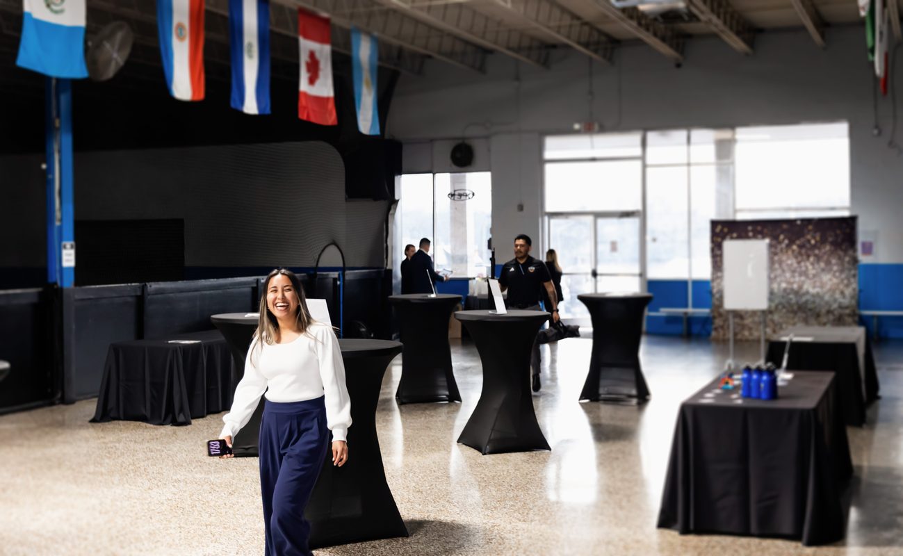 Corporate networking event at StudioX Soccer Arena with cocktail tables and open venue space